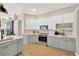 Modern kitchen with gray and white cabinets and quartz countertops at 4325 Swift Cir, Valrico, FL 33596