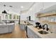 Modern kitchen with gray and white cabinets and quartz countertops at 4325 Swift Cir, Valrico, FL 33596