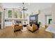 Living room with vaulted ceilings, fireplace, and hardwood floors at 4325 Swift Cir, Valrico, FL 33596