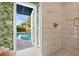 Spa-like bathroom with marble shower and pool view at 4811 Culbreath Isles Rd, Tampa, FL 33629