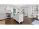 Bright white kitchen with large island and stainless steel appliances at 4811 Culbreath Isles Rd, Tampa, FL 33629