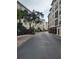 A well-maintained exterior street view of apartments, featuring neat landscaping and trees creating a serene environment at 501 Knights Run Ave # 1113, Tampa, FL 33602