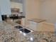 Kitchen featuring stainless steel appliances, granite counter, and a breakfast bar at 501 Knights Run Ave # 1113, Tampa, FL 33602