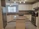 Bright kitchen features granite counters, stainless appliances, and a center island at 501 Knights Run Ave # 1113, Tampa, FL 33602