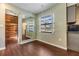 Charming dining area with wood-look floors and a rustic wall accent at 5043 Mockingbird Dr, Dade City, FL 33523