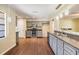 Modern kitchen with gray cabinets, stainless steel appliances, and granite countertops at 5043 Mockingbird Dr, Dade City, FL 33523