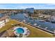 Aerial view of community pool, marina, and waterfront at 5197 Silent Loop # 224, New Port Richey, FL 34652