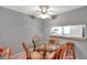 Dining area with glass table and wicker chairs at 5197 Silent Loop # 224, New Port Richey, FL 34652