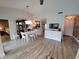 Bright dining room with white table and wooden hutch at 562 Andorra Ne Cir # 562, St Petersburg, FL 33703