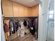 Large walk-in closet with ample shelving and hanging space at 562 Andorra Ne Cir # 562, St Petersburg, FL 33703