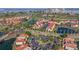 Aerial view of waterfront community with lush landscaping, golf course, and numerous buildings at 6085 Bahia Del Mar Blvd # 105, St Petersburg, FL 33715