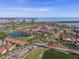 Aerial view of community near water, golf course, and bridge at 6085 Bahia Del Mar Blvd # 105, St Petersburg, FL 33715