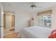 Bedroom with double bed, light wood floors, and access to hallway at 6085 Bahia Del Mar Blvd # 105, St Petersburg, FL 33715