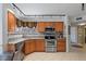 Kitchen with stainless steel appliances and wood cabinets at 6085 Bahia Del Mar Blvd # 105, St Petersburg, FL 33715