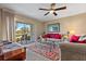 Living room with comfy sofas, a coffee table and sliding doors to patio at 6085 Bahia Del Mar Blvd # 105, St Petersburg, FL 33715