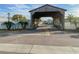 Quaint community entrance with a charming wooden bridge at 6103 Elmhurst Dr, New Port Richey, FL 34653