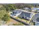 Aerial view of homes with pool and landscape at 6210 Nikki Ln, Odessa, FL 33556