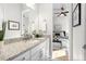 Bathroom with granite countertop and a view of the bedroom at 6210 Nikki Ln, Odessa, FL 33556