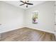 Simple bedroom with laminate wood flooring and a window at 6210 Nikki Ln, Odessa, FL 33556