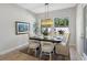 Bright dining room with hardwood floors and a view of the backyard at 6210 Nikki Ln, Odessa, FL 33556