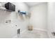 Laundry room with shelving and built-in storage at 6210 Nikki Ln, Odessa, FL 33556