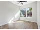 Well-lit bedroom with hardwood floors and large window at 6210 Nikki Ln, Odessa, FL 33556