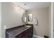 Well-lit bathroom with granite vanity and tiled floor at 6322 Palma Del Mar S Blvd # 1001, St Petersburg, FL 33715