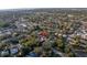 Aerial view of a single story home nestled amongst lush trees at 6327 Emerson S Ave, St Petersburg, FL 33707