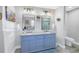 Bathroom featuring a double vanity and updated fixtures at 6327 Emerson S Ave, St Petersburg, FL 33707