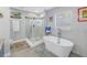 Spa-like bathroom with soaking tub and walk-in shower at 6327 Emerson S Ave, St Petersburg, FL 33707