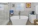 Relaxing bathroom with a free-standing soaking tub and marble accents at 6327 Emerson S Ave, St Petersburg, FL 33707