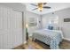 Bright bedroom with double closet and a blue fish patterned comforter at 6327 Emerson S Ave, St Petersburg, FL 33707