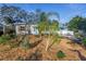 Landscaped yard with a charming bungalow and a palm tree at 6327 Emerson S Ave, St Petersburg, FL 33707