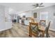 Bright kitchen with white cabinets, wood dining table, and stainless steel appliances at 6327 Emerson S Ave, St Petersburg, FL 33707