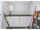 White cabinets and wooden countertop in a laundry area at 6327 Emerson S Ave, St Petersburg, FL 33707