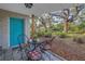 Small patio with a bistro set and view of the backyard at 6327 Emerson S Ave, St Petersburg, FL 33707