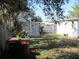 Backyard with shed and neighboring buildings visible at 6720 Hibiscus S Ave, South Pasadena, FL 33707