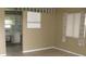 Living room with kitchen access and tiled floor at 6720 Hibiscus S Ave, South Pasadena, FL 33707