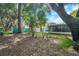 Spacious backyard with a view of the house at 717 Carolina Ave, Tarpon Springs, FL 34689