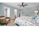 King-size bed, sitting chair, and access to bathroom at 717 Carolina Ave, Tarpon Springs, FL 34689