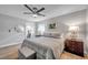 Main bedroom with ceiling fan and en-suite bathroom access at 717 Carolina Ave, Tarpon Springs, FL 34689