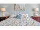 Bedroom with floral bedding, two nightstands, and lamps at 717 Carolina Ave, Tarpon Springs, FL 34689