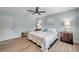 Spacious bedroom with king-size bed and ceiling fan at 717 Carolina Ave, Tarpon Springs, FL 34689