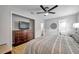 Main bedroom with ceiling fan and en-suite bathroom at 717 Carolina Ave, Tarpon Springs, FL 34689