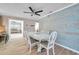 Bright dining room with farmhouse table and chairs at 717 Carolina Ave, Tarpon Springs, FL 34689