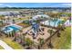 Community playground and pool with surrounding homes visible at 732 Ocean Spray Dr, Ruskin, FL 33570