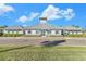 Community clubhouse with metal roof and landscaping at 732 Ocean Spray Dr, Ruskin, FL 33570