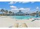 Community pool with lounge chairs and clubhouse in background at 732 Ocean Spray Dr, Ruskin, FL 33570