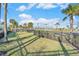 Community dog park with fenced area, grass, and palm trees at 732 Ocean Spray Dr, Ruskin, FL 33570