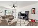 Spacious living room featuring sectional sofa and entertainment center at 732 Ocean Spray Dr, Ruskin, FL 33570